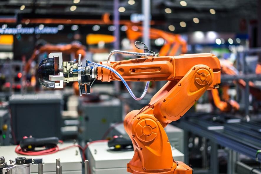 How do AI Robots Compare to Traditional Industrial Robots in terms of Cost and Performance?